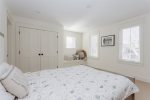 Spacious bedroom with ensuite bathroom and adorable bench seat